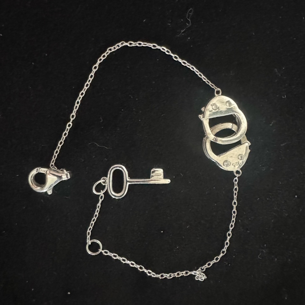 Elegant Silver Key and Handcuffs Bracelet